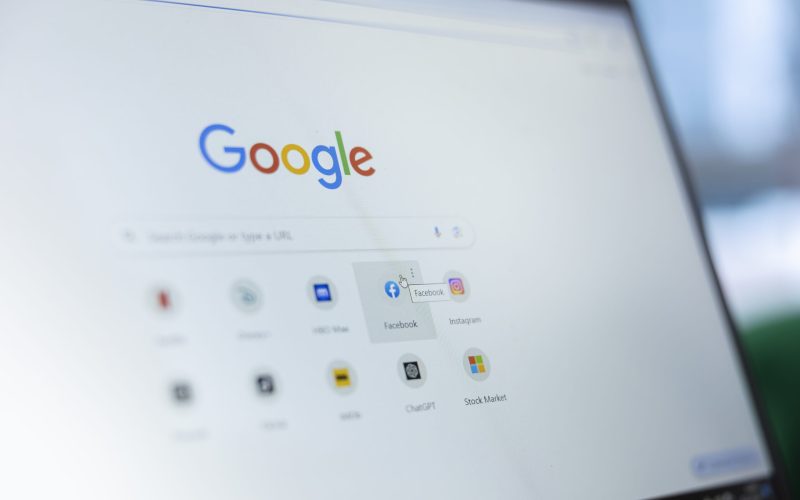 Bucharest, Romania - July 30th 2024 - Young man clicks on Facebook page bookmark on Google, looking at his search engine saved icons and selecting social media platform to stay informed.